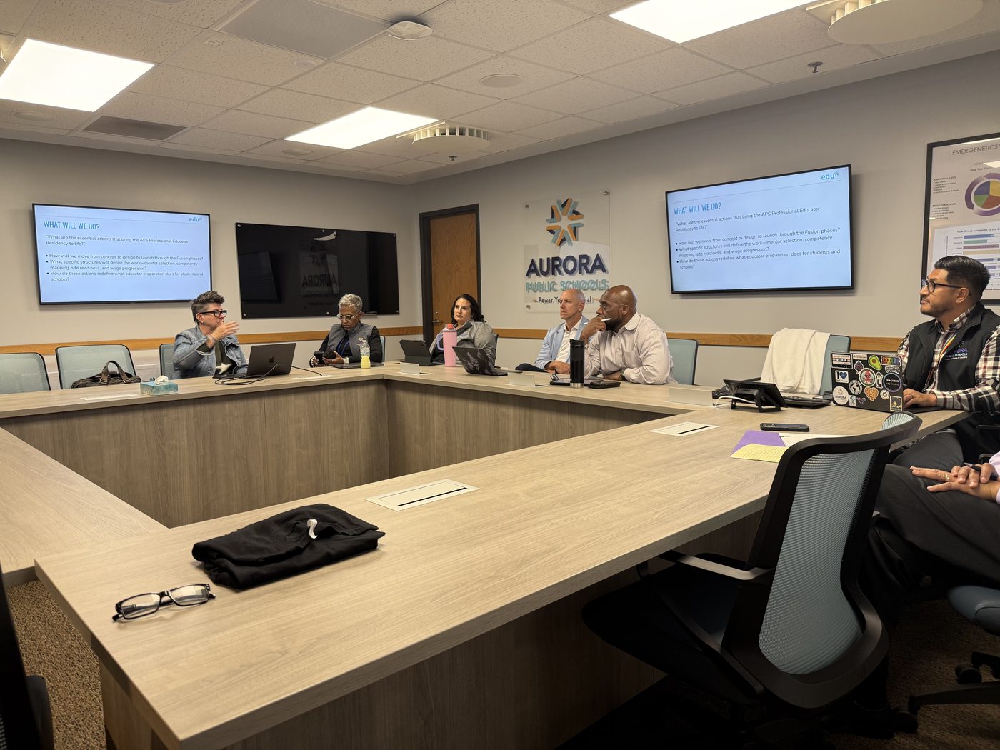 Teachers collaborating at Aurora Public Schools